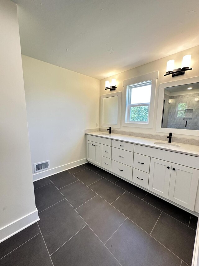 1846 Round Barn Dr, Hudsonville, MI 49426 - full bathroom with double vanity, tile patterned flooring, and a tile shower