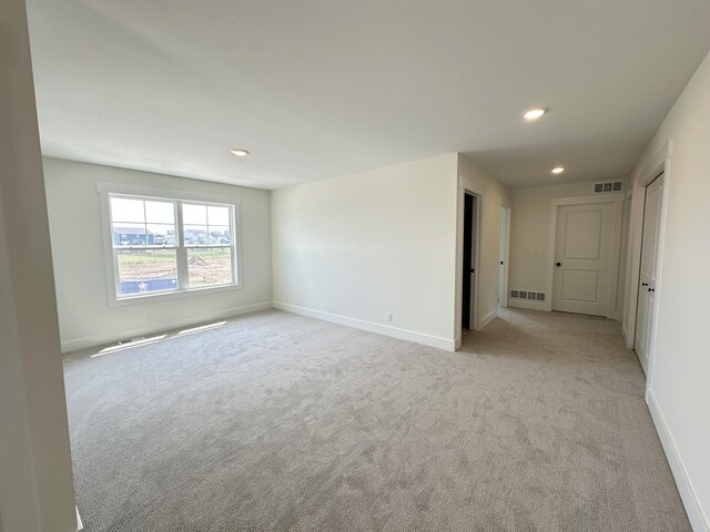 1846 Round Barn Dr, Hudsonville, MI 49426 - spare room with light colored carpet and recessed lighting