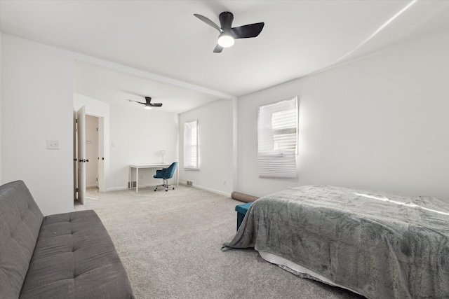 carpeted bedroom featuring a ceiling fan and baseboards