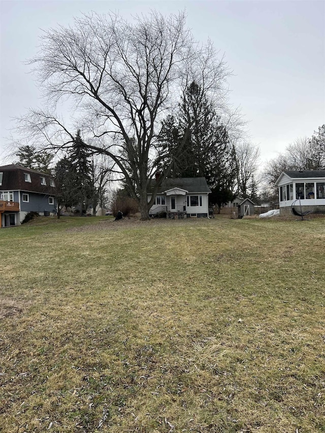 view of yard featuring a sunroom