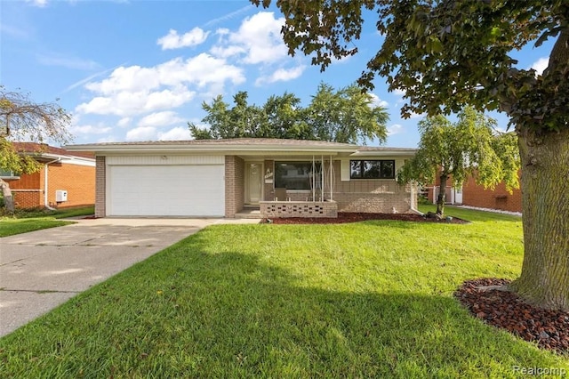 ranch-style home featuring concrete driveway, a front lawn, an attached garage, and brick siding