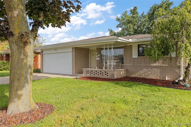 single story home with driveway, brick siding, a front lawn, and an attached garage