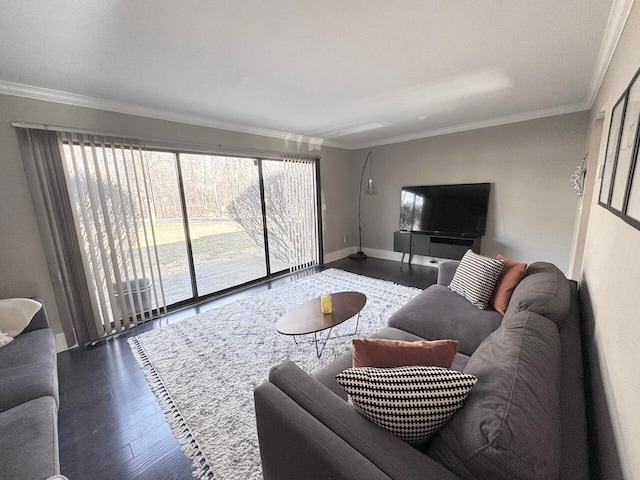 living room with baseboards, wood finished floors, and crown molding