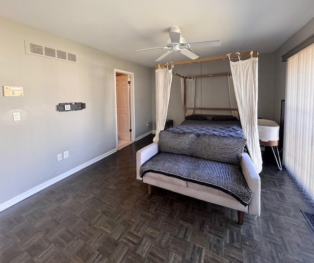 bedroom featuring visible vents, ceiling fan, and baseboards