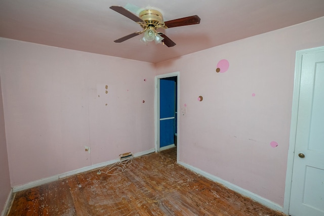 spare room featuring baseboards and a ceiling fan