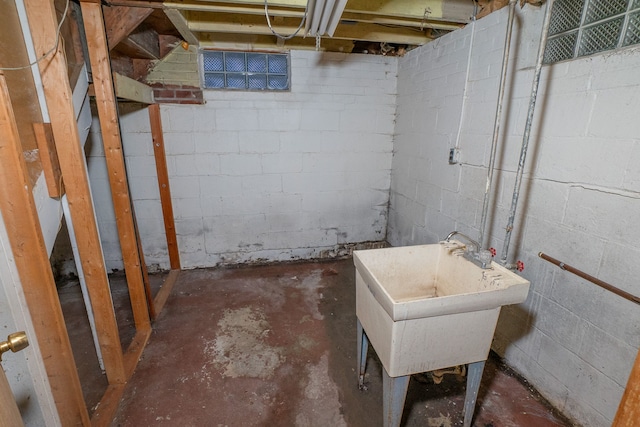 unfinished basement featuring a sink