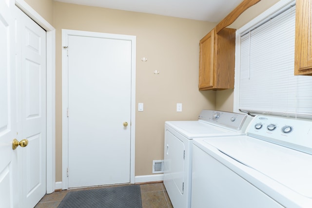 laundry room featuring tile patterned flooring, visible vents, baseboards, cabinet space, and independent washer and dryer