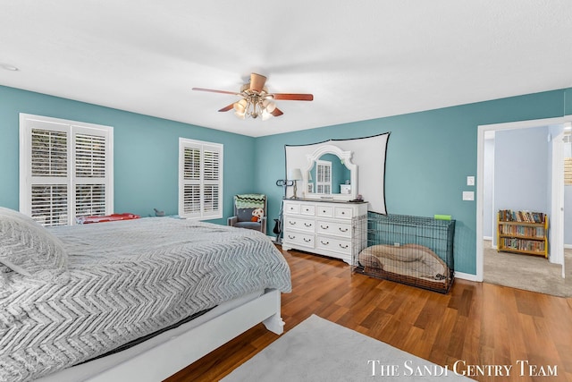 bedroom featuring ceiling fan, wood finished floors, and baseboards