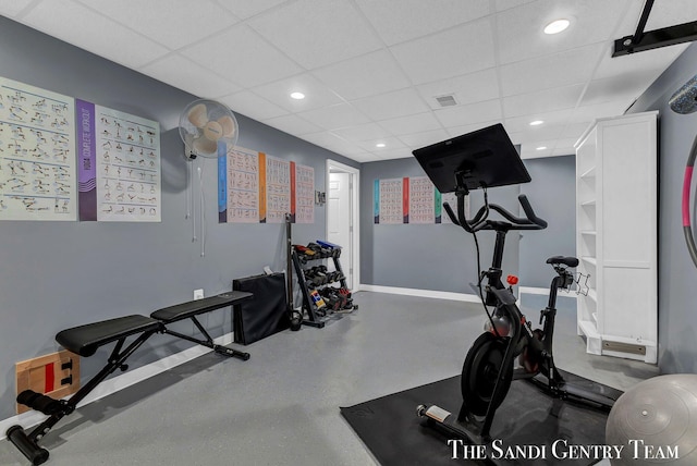 workout area with a paneled ceiling, visible vents, baseboards, and recessed lighting