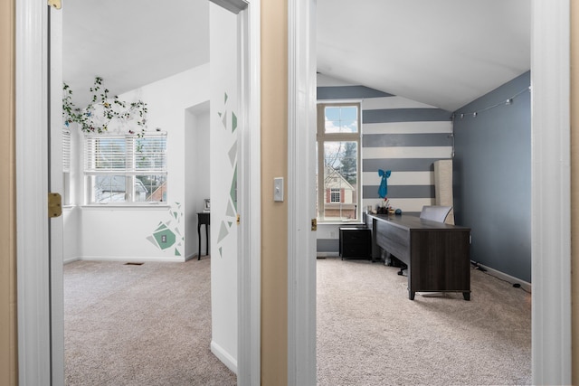 office with lofted ceiling, carpet flooring, and baseboards