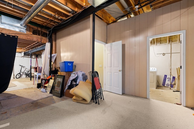 unfinished basement featuring washer / dryer