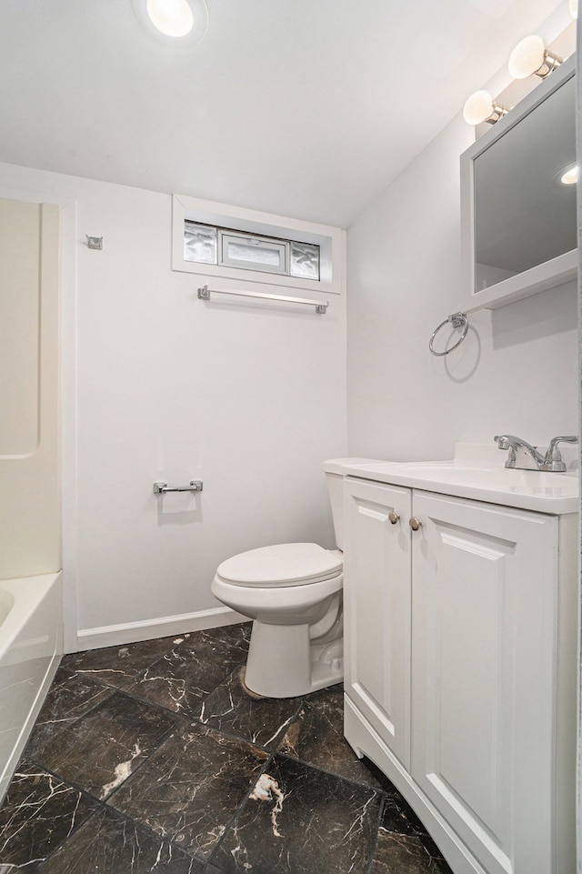 bathroom with marble finish floor, baseboards, vanity, and toilet