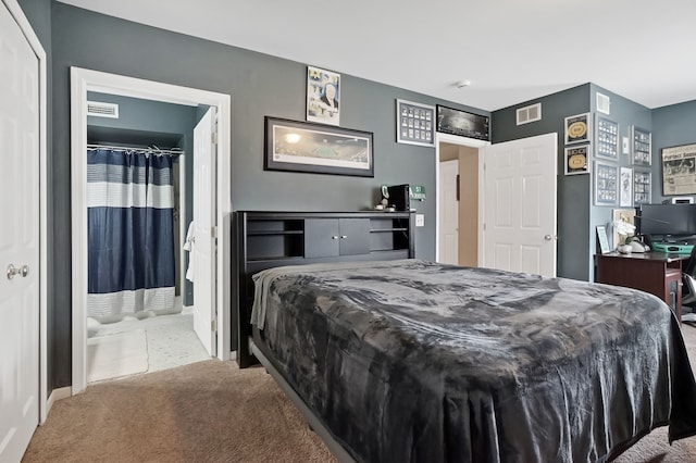 carpeted bedroom featuring visible vents