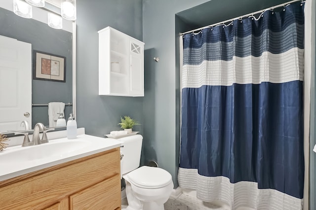 bathroom featuring toilet, a shower with curtain, and vanity