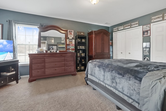 bedroom with light carpet