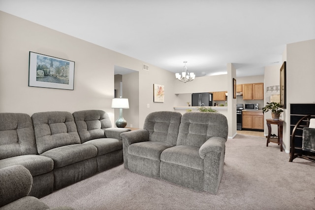 living area with light carpet, visible vents, and a notable chandelier