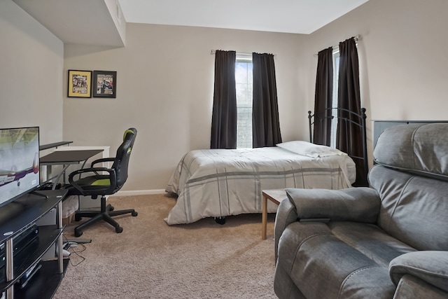 carpeted bedroom with baseboards