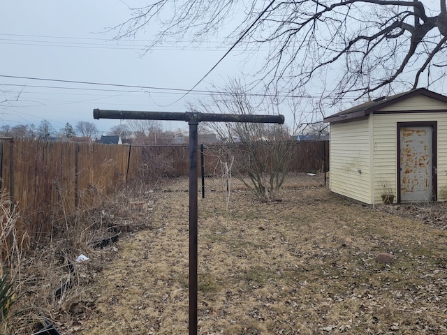 view of yard featuring an outbuilding and a fenced backyard