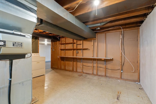 unfinished basement with washer / dryer and light floors