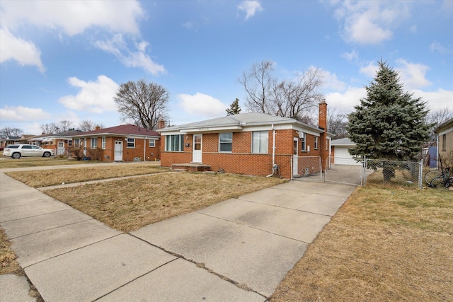 view of front of property featuring brick siding, fence, a gate, a chimney, and a front yard