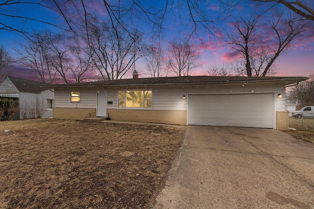 ranch-style house with concrete driveway, a garage, brick siding, and a chimney