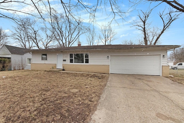 single story home featuring a garage, brick siding, concrete driveway, and a chimney