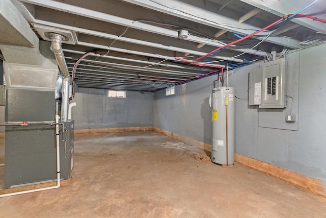 below grade area featuring heating unit, electric panel, baseboards, and electric water heater