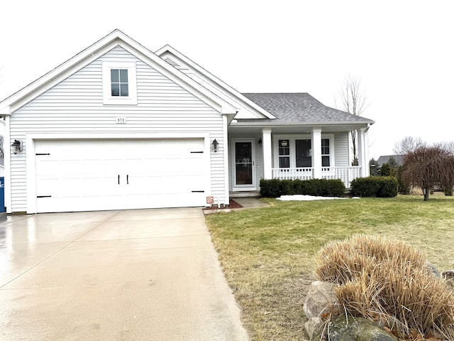 view of front of house with an attached garage, covered porch, concrete driveway, roof with shingles, and a front yard