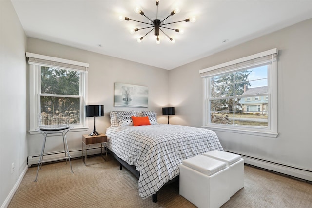 carpeted bedroom with a baseboard heating unit, multiple windows, and a chandelier