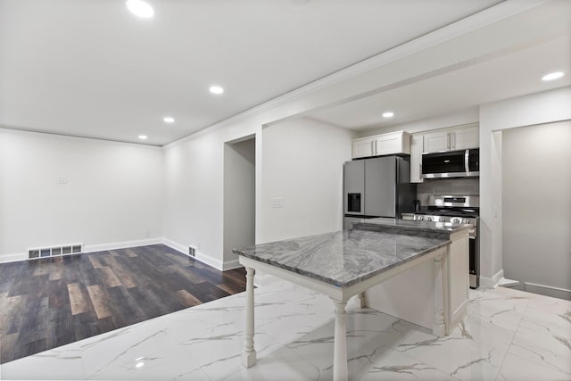 kitchen with visible vents, recessed lighting, stone countertops, stainless steel appliances, and white cabinets