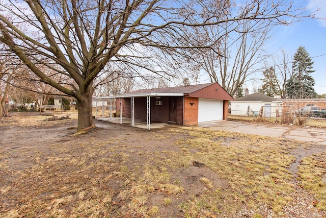 exterior space featuring an outbuilding and fence