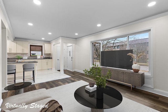 living area with recessed lighting, baseboards, crown molding, and dark wood-type flooring