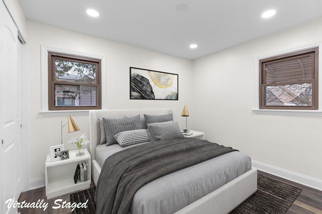 bedroom with dark wood-style floors, recessed lighting, and baseboards