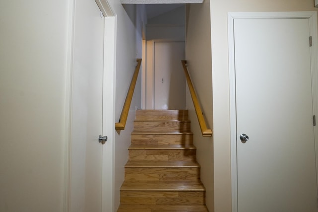 stairs with wood finished floors