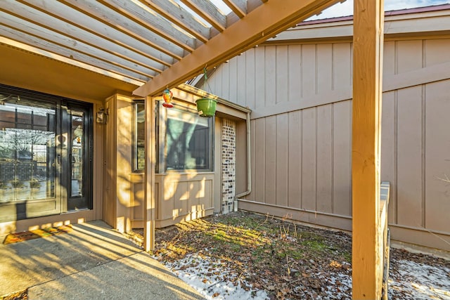 entrance to property featuring a pergola