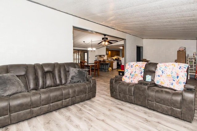 living area featuring ceiling fan and wood finished floors