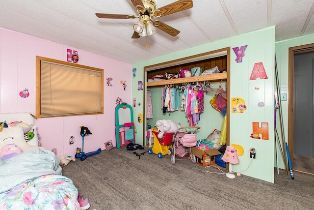 bedroom featuring carpet, a ceiling fan, and a closet