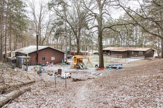 view of yard featuring a garden and a playground