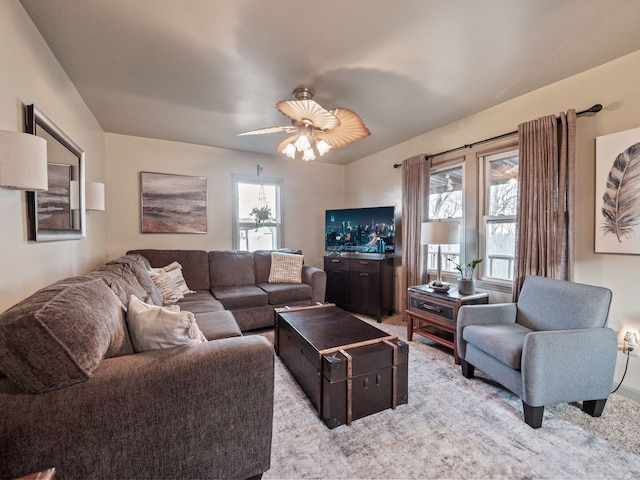 living area featuring a ceiling fan