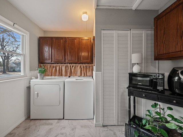 washroom with washer and dryer, marble finish floor, laundry area, and a toaster