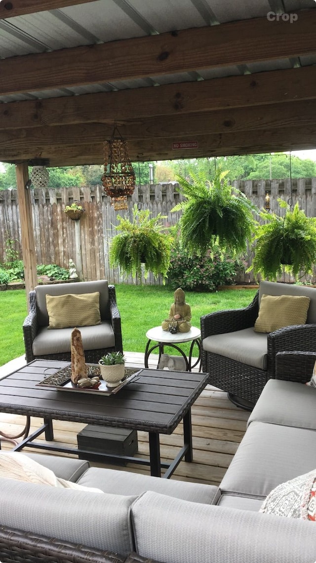 view of patio with outdoor lounge area and fence