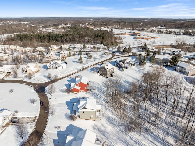 snowy aerial view with a residential view