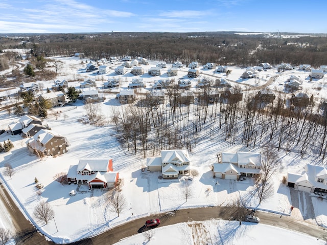 snowy aerial view featuring a residential view