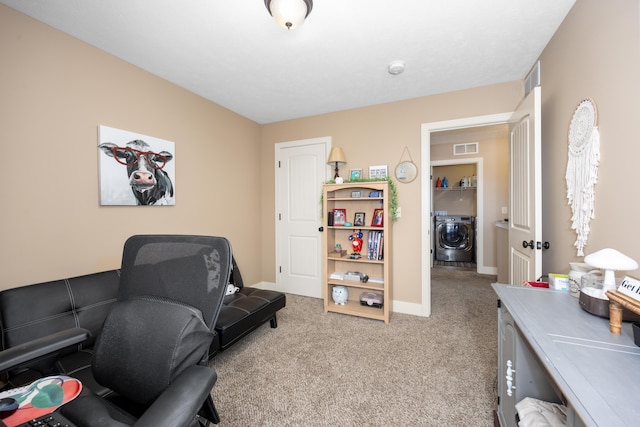 home office with washer / dryer, carpet, visible vents, and baseboards