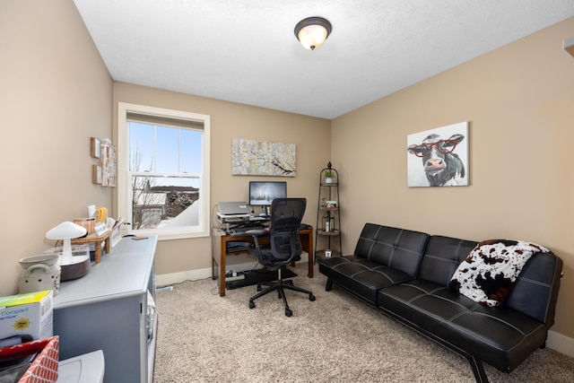 carpeted office featuring baseboards