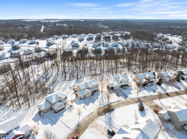 snowy aerial view with a residential view