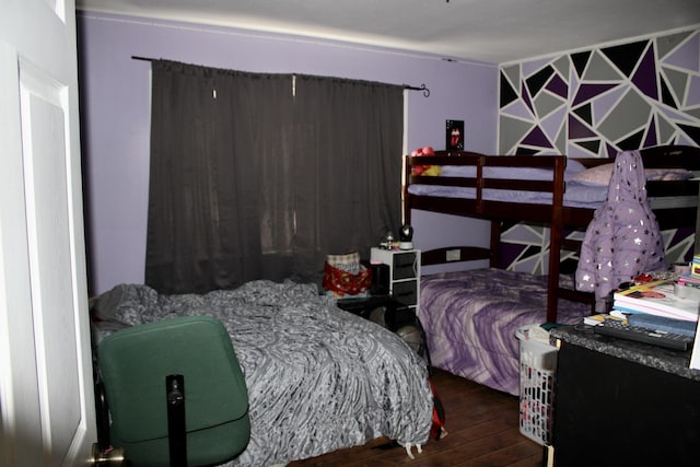 bedroom featuring wood finished floors