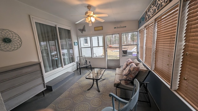 sunroom / solarium featuring ceiling fan