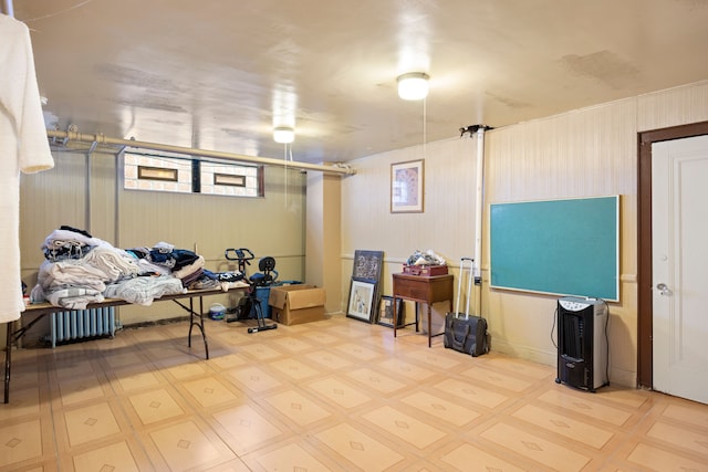 finished basement with tile patterned floors