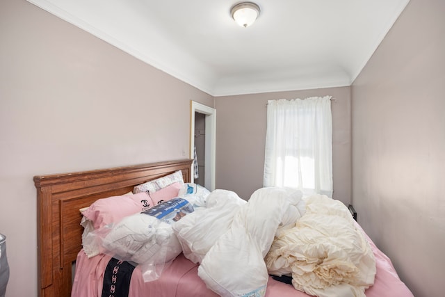 bedroom featuring crown molding